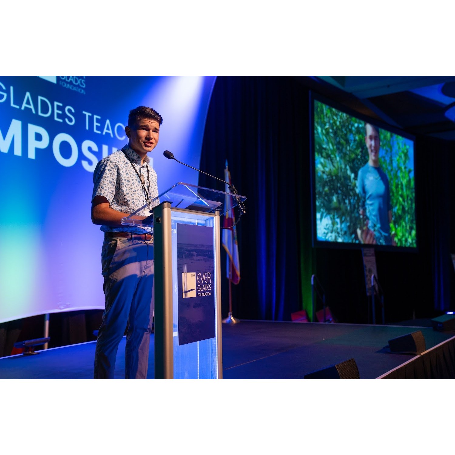 Keynote speaker Isaac Nelson on stage at the Everglades Teacher Symposium