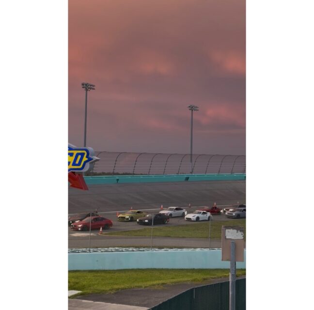 Homestead-Miami Speedway grandstands at sunset during Fast Lane Friday