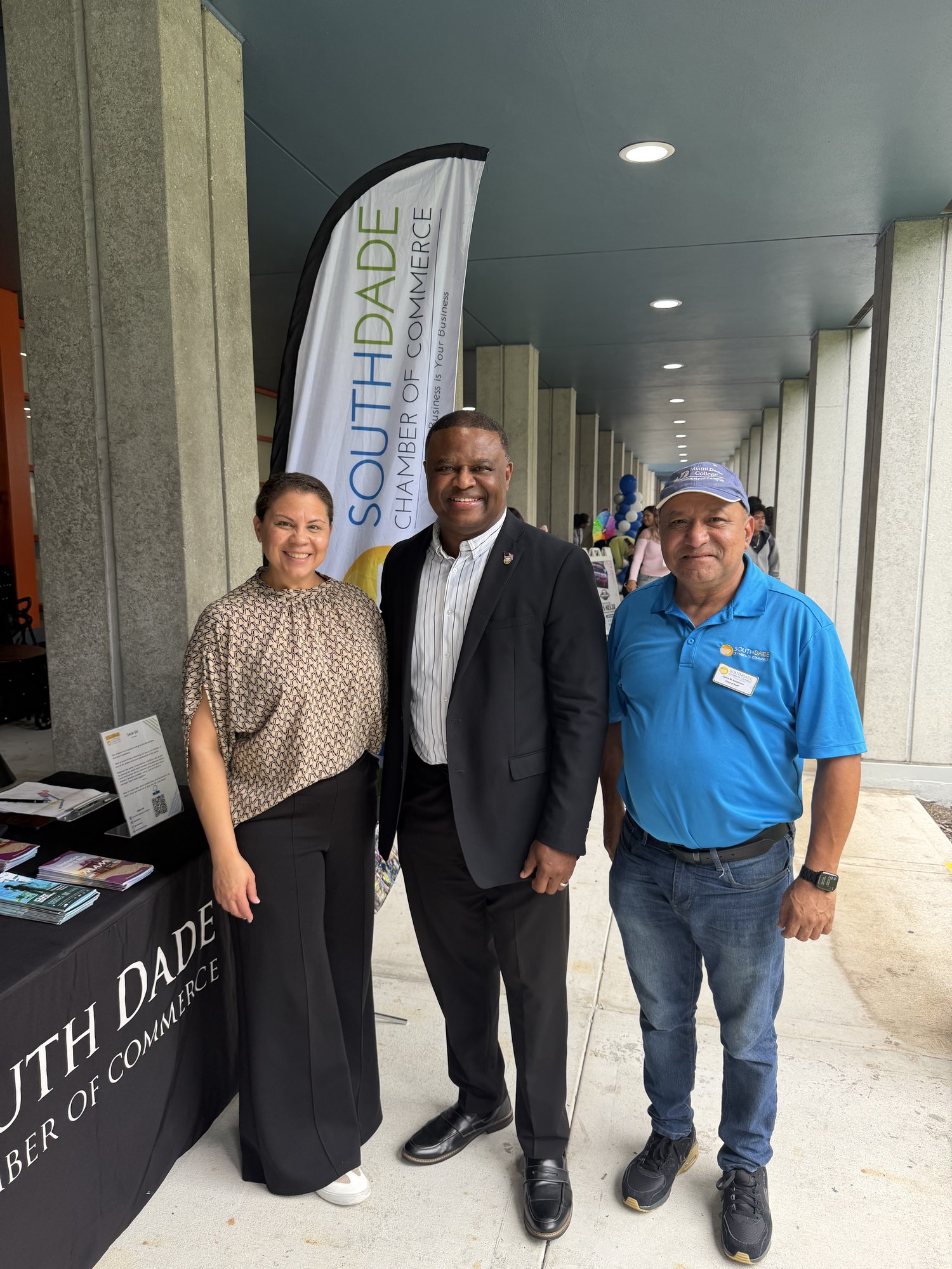 Chamber staff and members at the South Dade Chamber booth during a community event