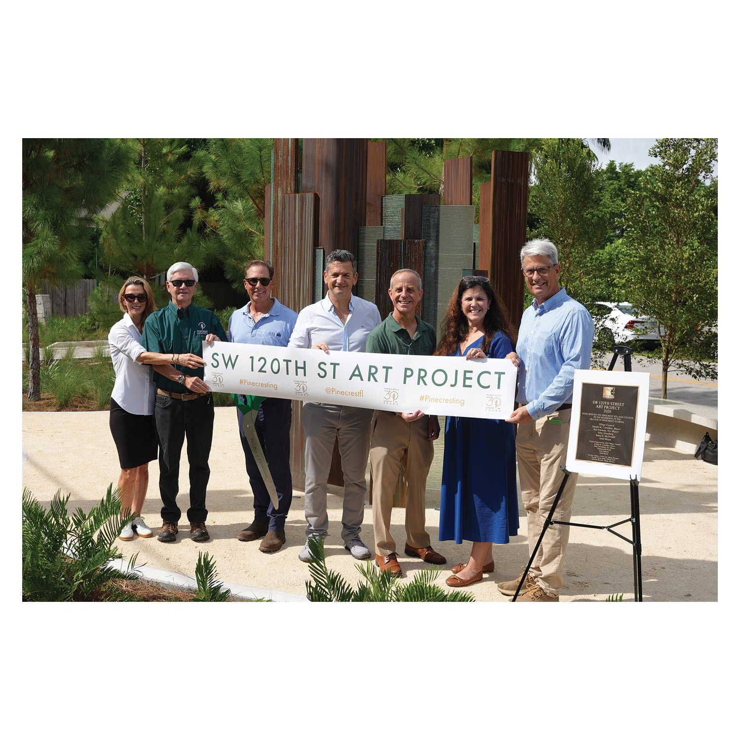 Pinecrest officials with the SW 120th Street Art Project banner at Traversal