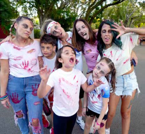 Families in zombie makeup at the Pinecrest Zombie Run