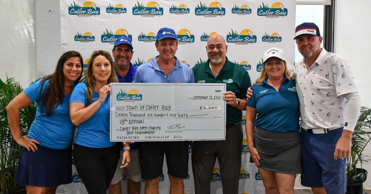 Cutler Bay Open Charity Golf Tournament team holding a big Town of Cutler Bay check